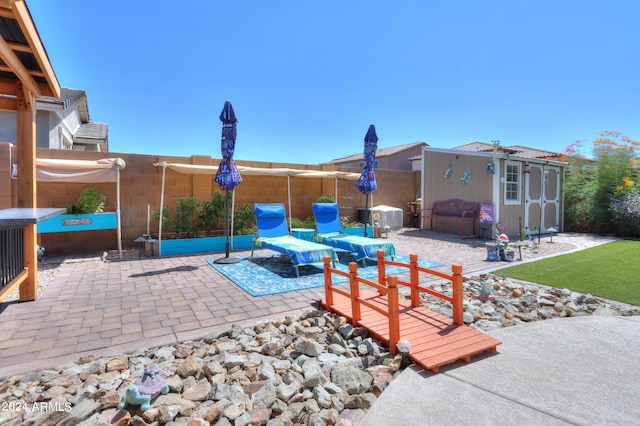 view of patio / terrace featuring an outbuilding