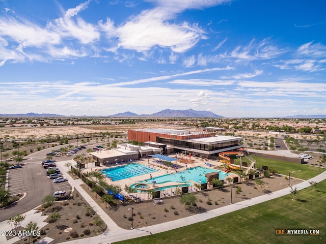 birds eye view of property with a mountain view