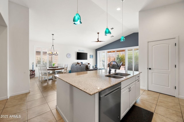 kitchen featuring stainless steel dishwasher, light tile patterned flooring, lofted ceiling, and a sink