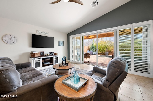 living area with light tile patterned flooring, lofted ceiling, visible vents, and a ceiling fan