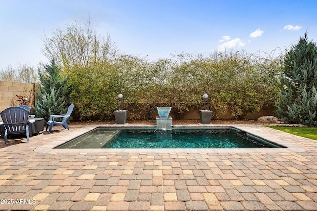 view of pool featuring a fenced in pool, fence, and a patio area