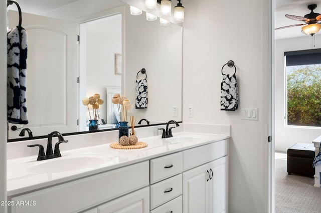 full bathroom featuring a ceiling fan, double vanity, and a sink
