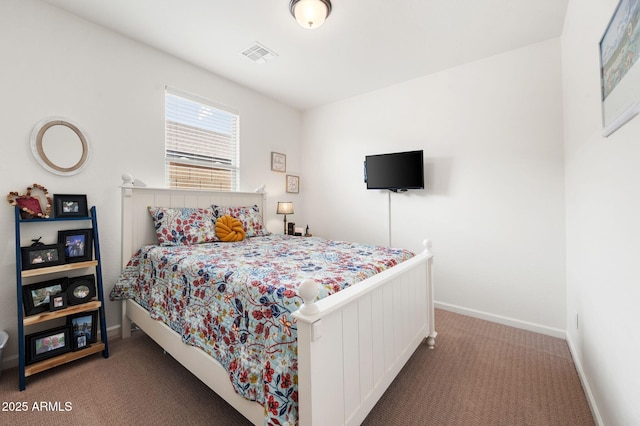 carpeted bedroom with baseboards and visible vents