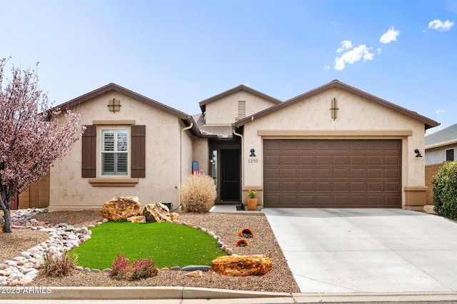 single story home with concrete driveway, stucco siding, and an attached garage