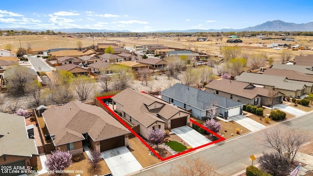 drone / aerial view with a residential view and a mountain view