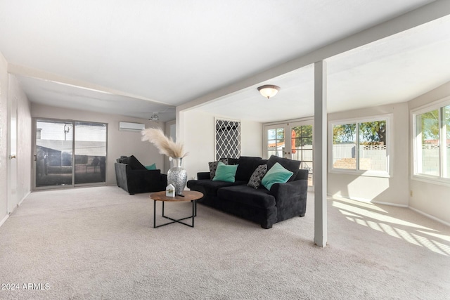 living room featuring a wall mounted air conditioner and light colored carpet