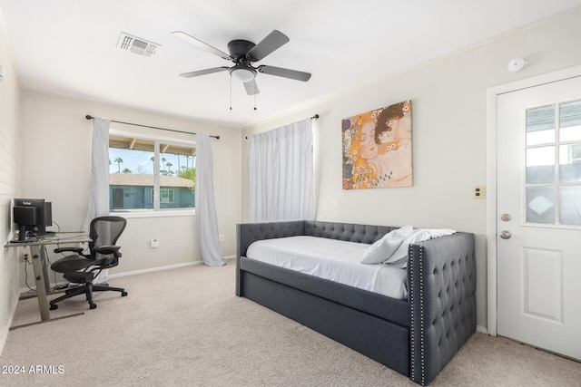 bedroom with carpet, ceiling fan, and ornamental molding