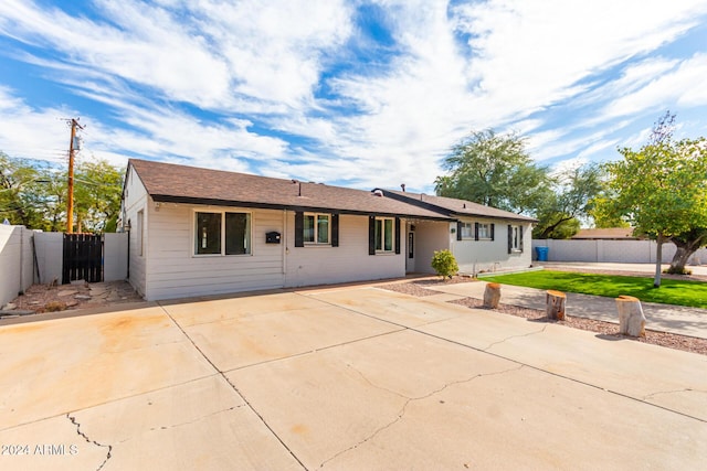 ranch-style home featuring a patio area