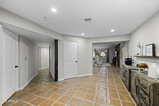 kitchen with recessed lighting, light tile patterned floors, and baseboards