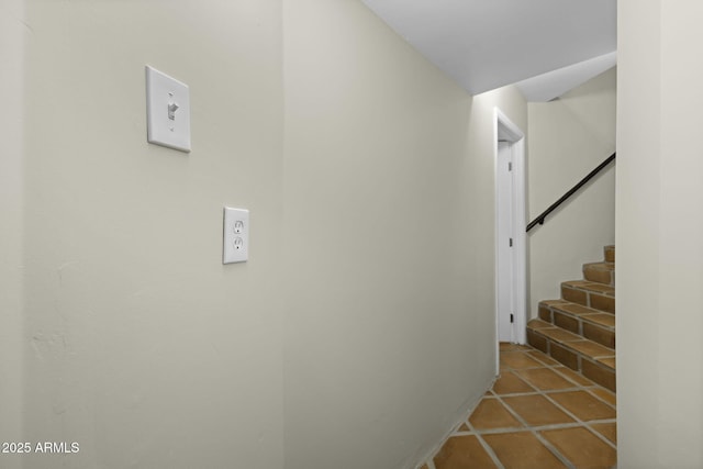 hall featuring stairway and tile patterned flooring