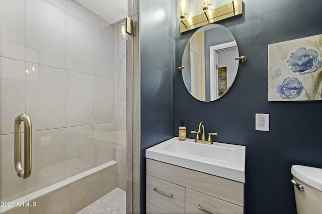 full bathroom with toilet, a tile shower, and vanity