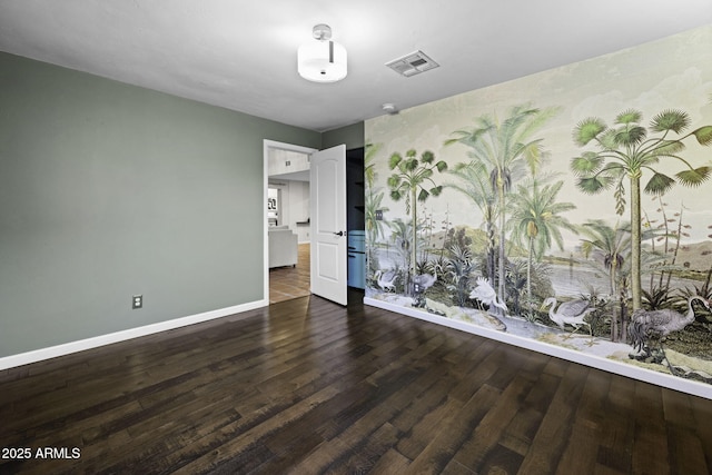 unfurnished bedroom featuring baseboards and wood finished floors