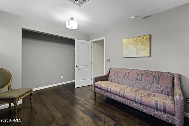 living room with hardwood / wood-style flooring and baseboards