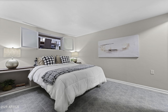 bedroom featuring baseboards