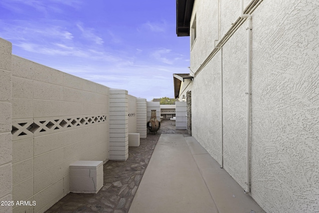 view of side of property featuring stucco siding