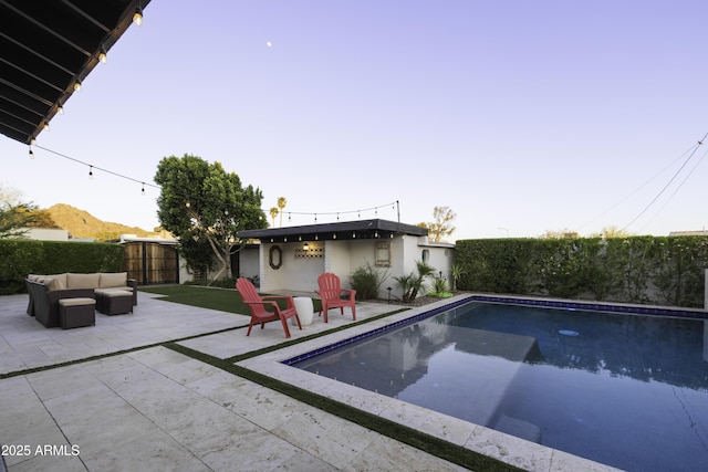 view of swimming pool with a patio area, a fenced backyard, and an outdoor hangout area