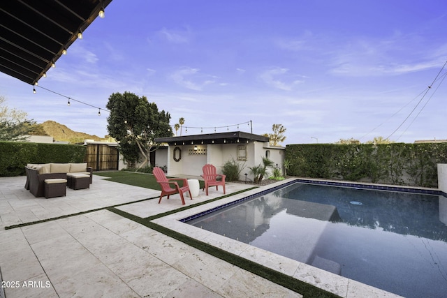 view of pool featuring a patio, a fenced backyard, and an outdoor living space
