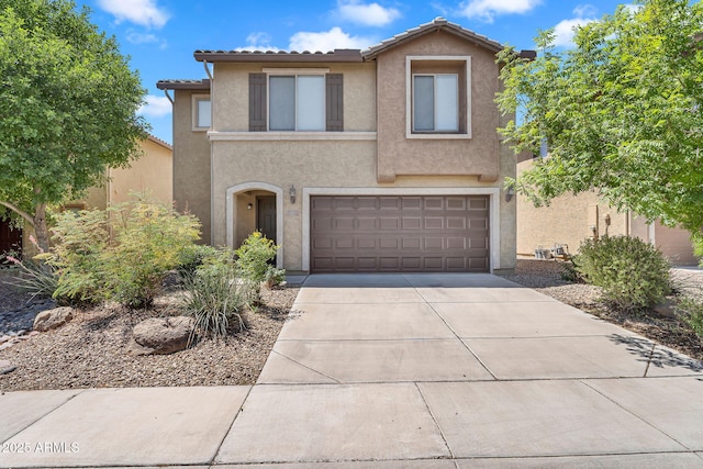 8071 W Georgetown Way, Florence, AZ 85132 - view of front facade featuring stucco siding, concrete driveway, a garage, and a tile roof