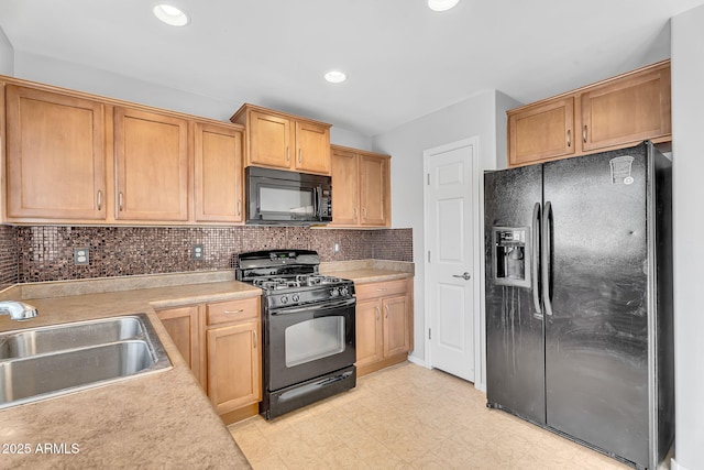 8071 W Georgetown Way, Florence, AZ 85132 - kitchen featuring black appliances, a sink, light floors, light countertops, and tasteful backsplash