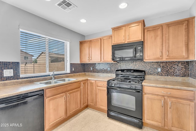 8071 W Georgetown Way, Florence, AZ 85132 - kitchen with black appliances, a sink, backsplash, light countertops, and recessed lighting