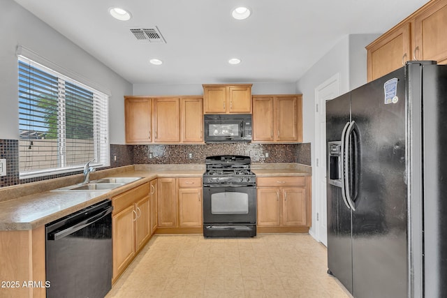 8071 W Georgetown Way, Florence, AZ 85132 - kitchen with black appliances, a sink, tasteful backsplash, recessed lighting, and light countertops