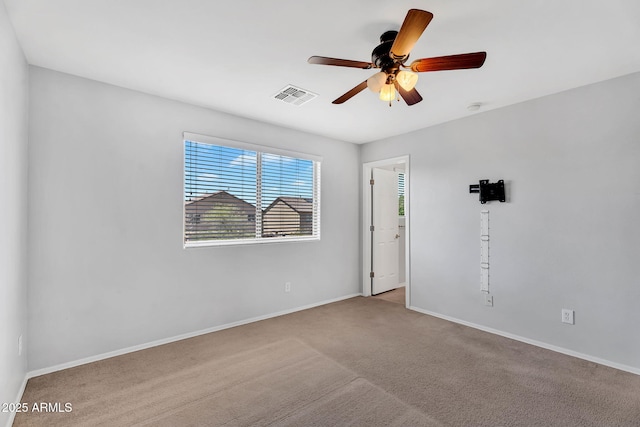 8071 W Georgetown Way, Florence, AZ 85132 - carpeted empty room featuring a ceiling fan and baseboards