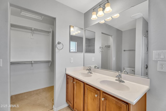 8071 W Georgetown Way, Florence, AZ 85132 - bathroom featuring double vanity, baseboards, a shower, and toilet