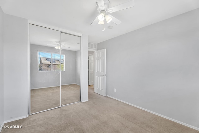 8071 W Georgetown Way, Florence, AZ 85132 - unfurnished bedroom featuring carpet floors, a closet, a ceiling fan, and baseboards
