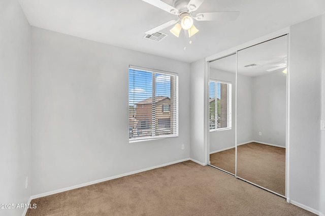 8071 W Georgetown Way, Florence, AZ 85132 - unfurnished bedroom with carpet flooring, baseboards, a closet, and ceiling fan