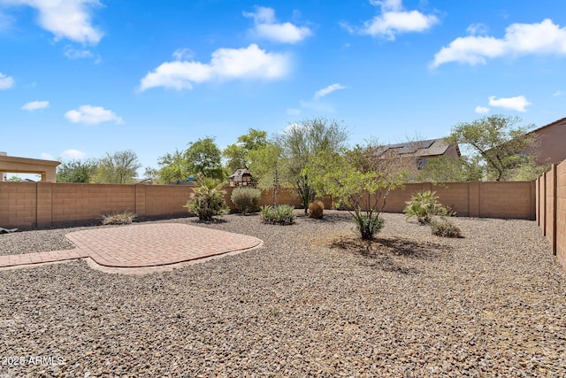 8071 W Georgetown Way, Florence, AZ 85132 - fenced backyard featuring a patio area