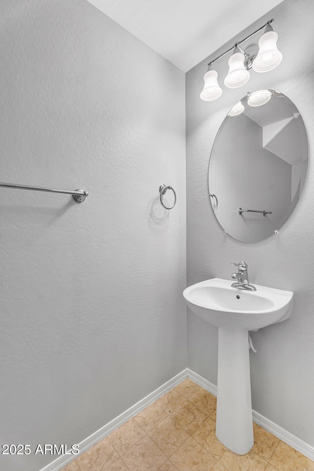8071 W Georgetown Way, Florence, AZ 85132 - bathroom with baseboards, a sink, and tile patterned floors