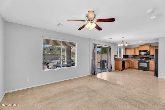 8071 W Georgetown Way, Florence, AZ 85132 - unfurnished living room featuring baseboards, a chandelier, ceiling fan, and light colored carpet