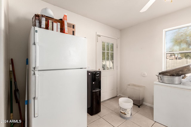 kitchen with ceiling fan, white fridge, and light tile patterned floors