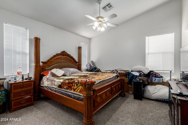 bedroom featuring ceiling fan, carpet floors, and vaulted ceiling