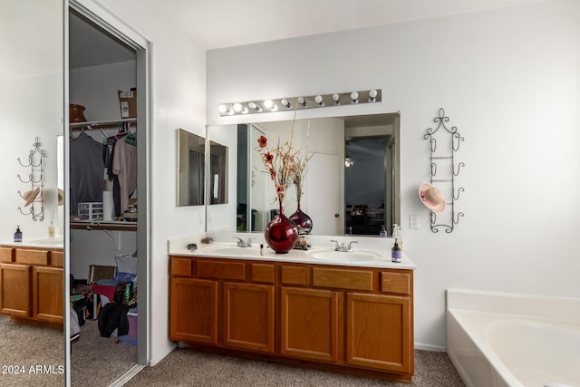 bathroom featuring a bathing tub and vanity