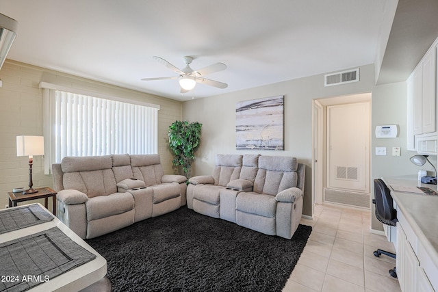 tiled living room featuring ceiling fan