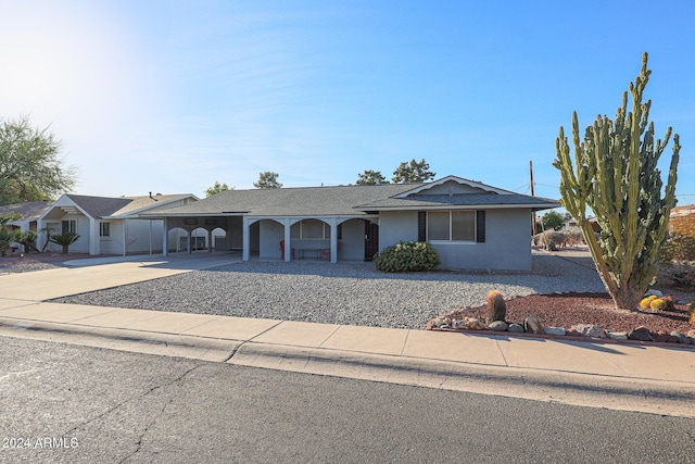 ranch-style home with a carport