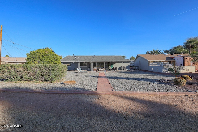 single story home featuring a patio