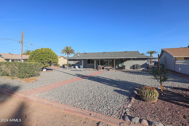 ranch-style home with a patio