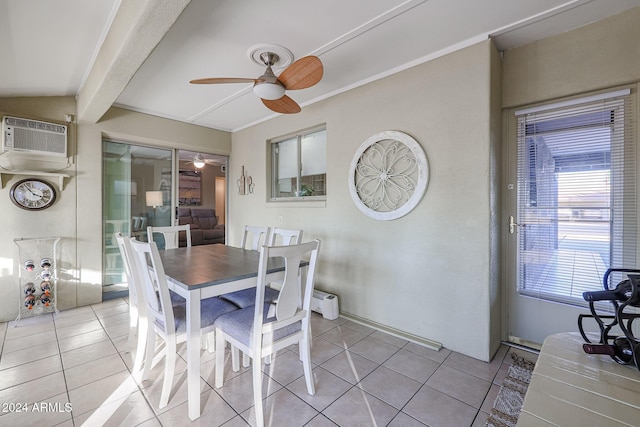 tiled dining area featuring an AC wall unit and ceiling fan