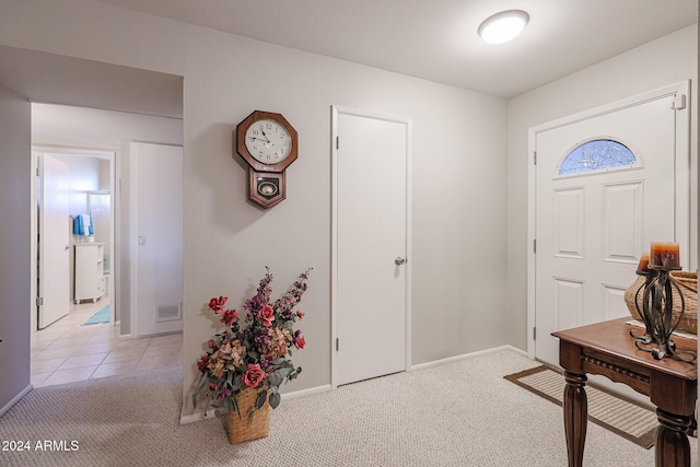 view of carpeted foyer