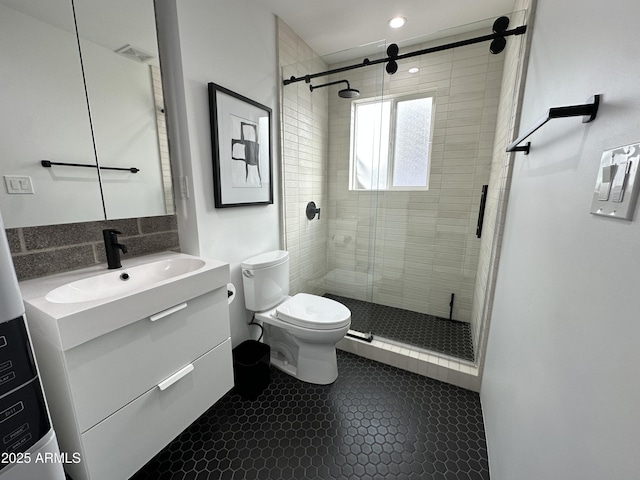 full bathroom featuring visible vents, toilet, a shower stall, vanity, and tile patterned flooring