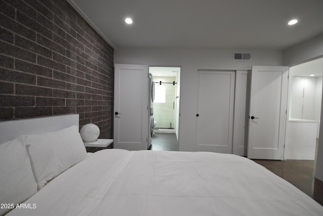 bedroom featuring recessed lighting, visible vents, a closet, and ensuite bathroom