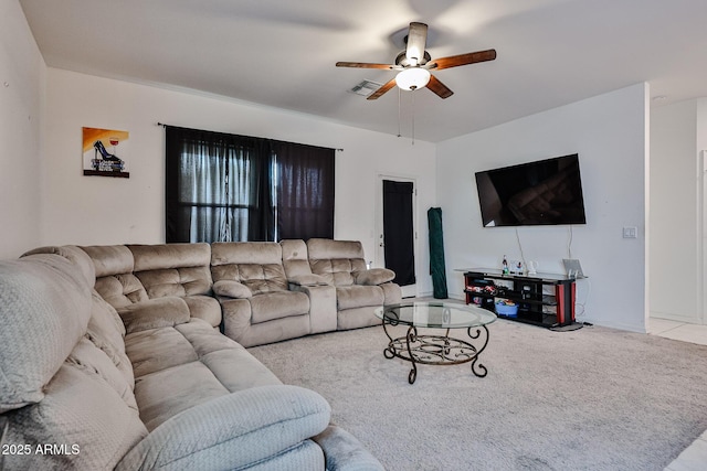 carpeted living room featuring visible vents and ceiling fan