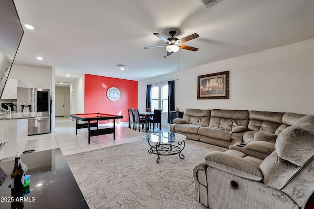 living area featuring light tile patterned floors, ceiling fan, billiards, and visible vents