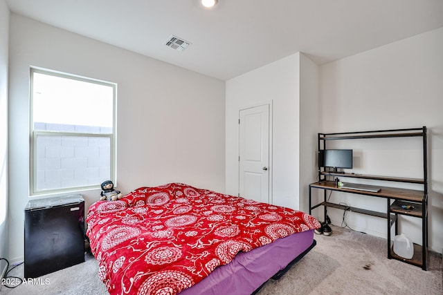 bedroom with carpet and visible vents