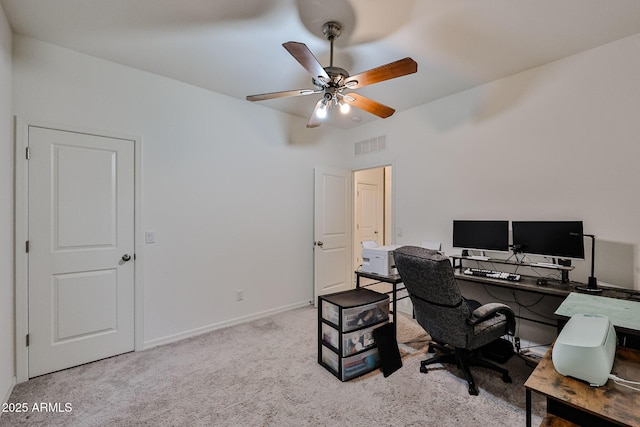 carpeted office with visible vents, ceiling fan, and baseboards