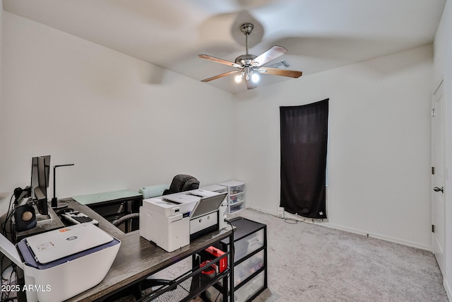 carpeted home office with visible vents, ceiling fan, and baseboards