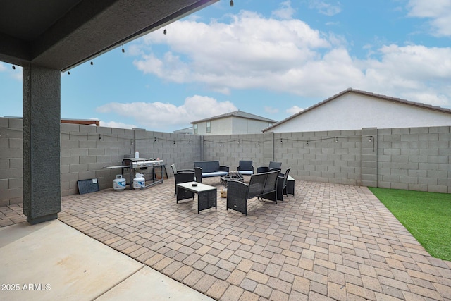 view of patio with a fenced backyard and an outdoor living space