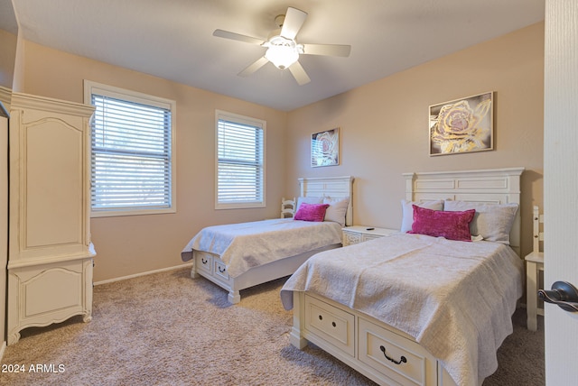 bedroom featuring ceiling fan and light colored carpet